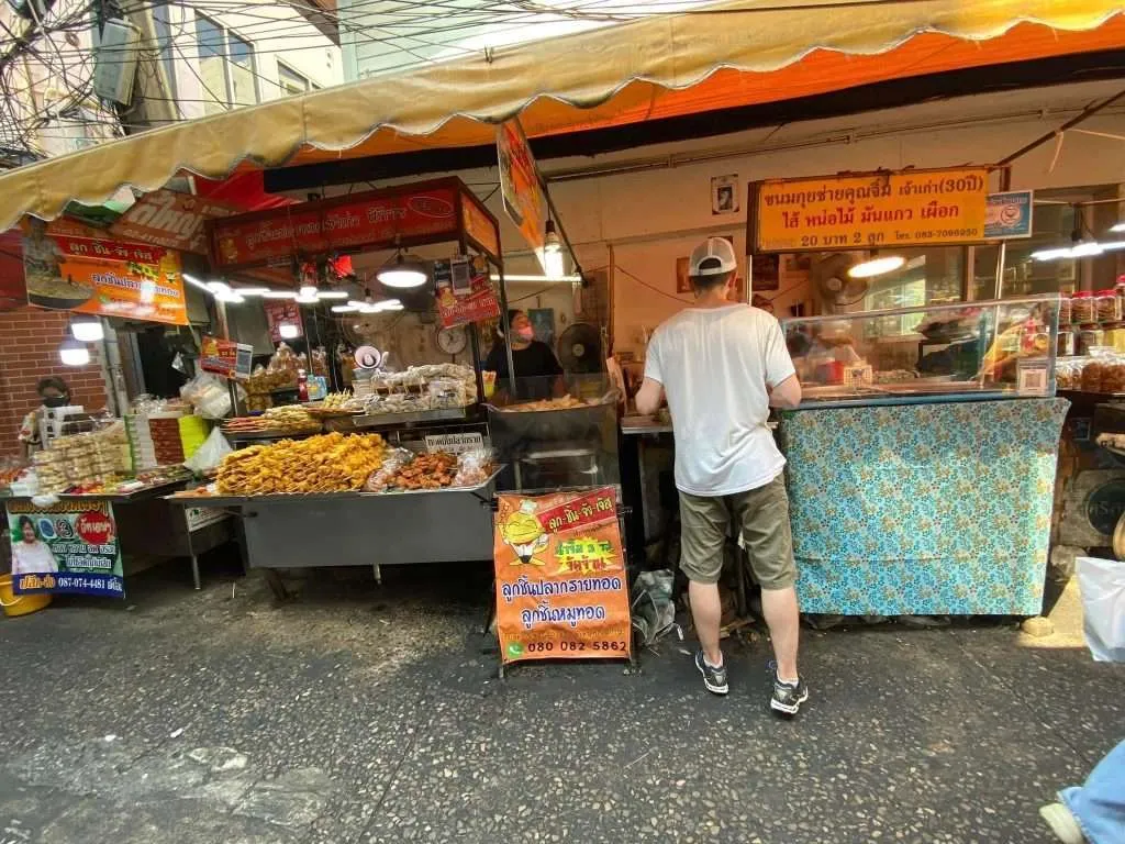 Tasting the various Thai delicacies within the Wang Lang market, in the heart of Bangkok