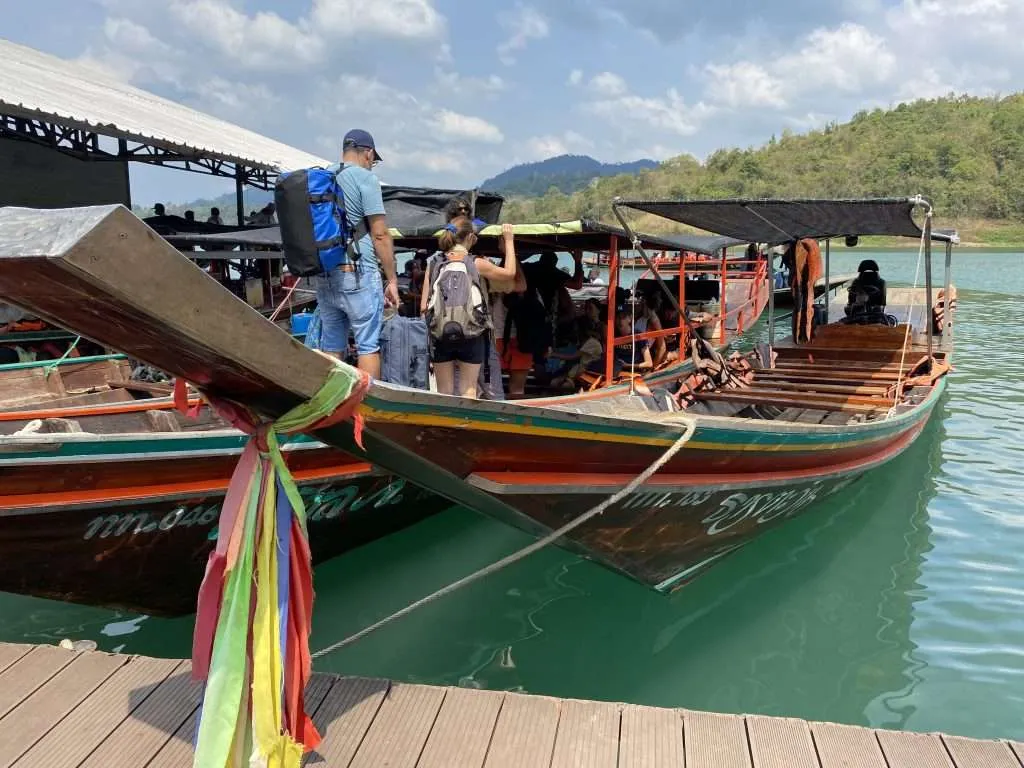Boarding the long boat to take us to the floating bungalows